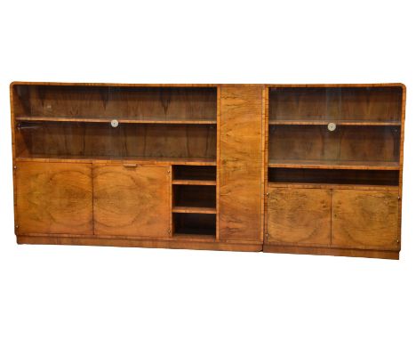 An Art Deco figured walnut two part bookcase cabinet Austrian, 1930s, of rectangular form with inset plinth base and rounded 