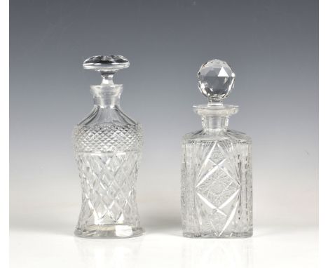 Two cut glass decanters the first thistle shaped with mushroom stopper and star-cut base, the other square with cantered corn