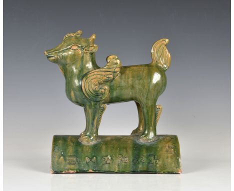 A Chinese green glazed winged dog roof tile modern, the winged dog modelled in the standing  position, the crescent section w