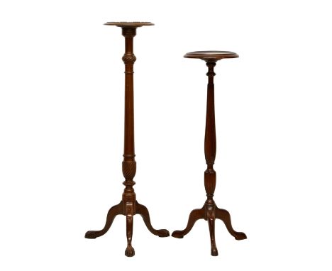 Two 19th century mahogany torchère the first with dished top over reeeded and fluted column, on swept tripod base with pad fe
