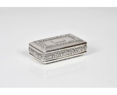A George III silver snuff box JS, probably John Shaw, Birmingham, 1818, rectangular cushion form, foliate chased borders, vac