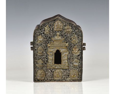 An antique Tibetan white metal, brass and copper Gau (portable shrine) probably 18th century, of box form with removable back