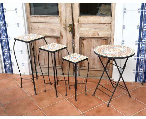 A graduated set of three mosaic and wrought iron lamp tables late 20th century, the largest 11in. (28cm.) square, 27¼in. (69.