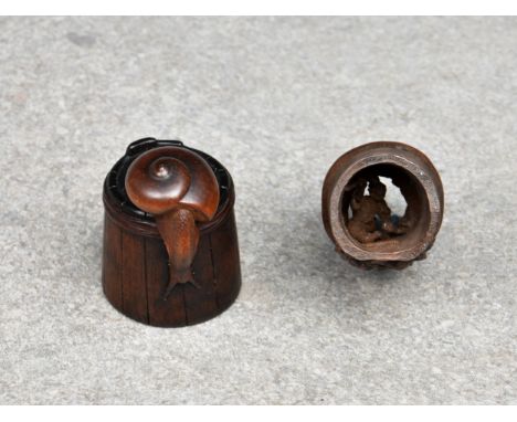 Two Japanese carved boxwood netsukes 18th / 19th century, comprising a finely carved boxwood netsuke of a snail on an upturne
