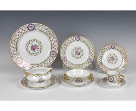 An extensive modern Haviland Limoges porcelain ' Louveciennes ' pattern dinner service decorated with foliate scroll and flow