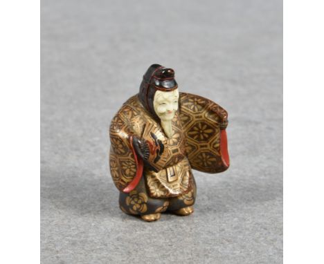 A Japanese lacquered wood netsuke of a noh actor probably 19th / early 20th century, unsigned, in the character of the old ma