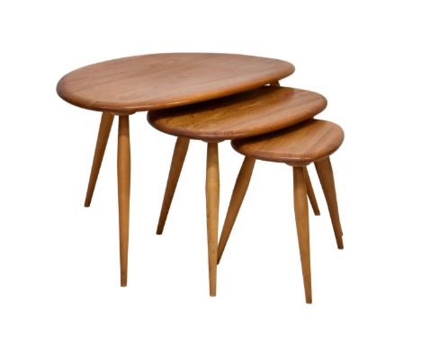 A nest of three Ercol elm and beech 'Pebble' tables the shaped tops over splayed tapering legs, 25½ x 17¾in. (65 x 44cm.), 16