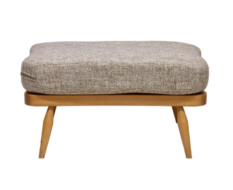 An Ercol model 341 beech foot stool with beige cushion, the serpentine base on splayed tapering legs, 27½ x 20in. (70 x 51cm.