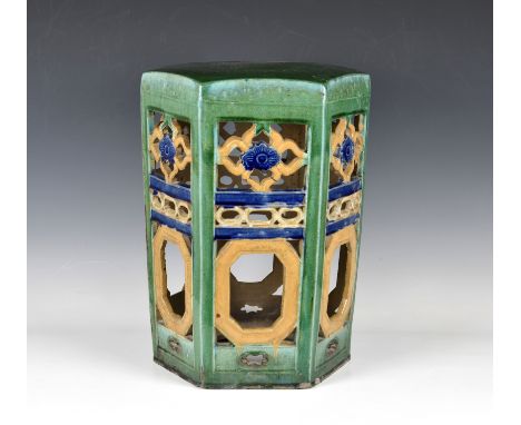 A Chinese Sancai glazed stoneware hexagonal garden seat probably 19th century, with pierced panel sides, all-over mottled gre