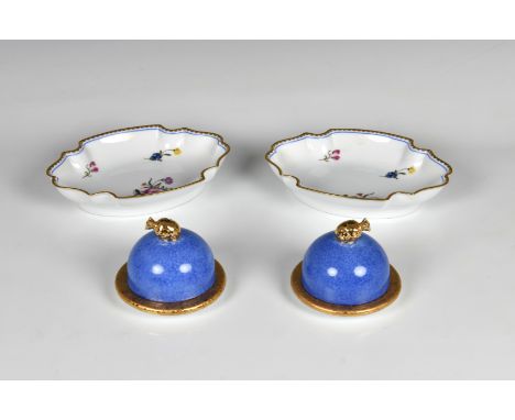 A pair of Laure Japy Limoges trinket boxes of circular domed form in blue and gold gilt, having pull-off covers with pineappl