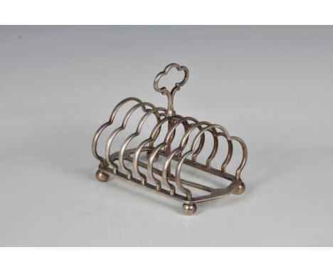 A Victorian silver six division toast rack Robert Garrard II, London, 1859, stamped with retailer 'GARRARDS Panton Street LON