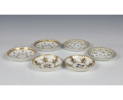 A pair of Caughley porcelain dishes / saucers scallop rim, having blue flowers, highlighted in gold gilt, underglaze 'S' mark