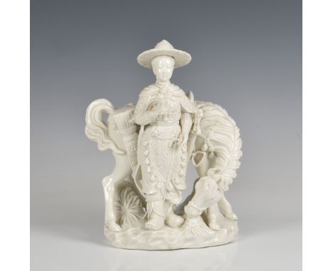 A blanc-de-chine porcelain figure of a young warrior and horse probably 20th century, the figure standing holding a bow, besi