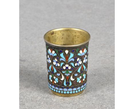 A Russian silver gilt and champlevé enamel vodka cup maker's mark indistinct, late 19th century, 1899-1916 Koloshnik 84 stand