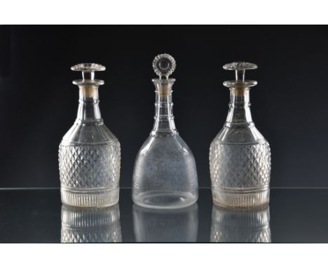 A pair of Georgian diamond, panel &amp; comb cut glass mallet decanters two banded neck, the body with panel cut shoulder and