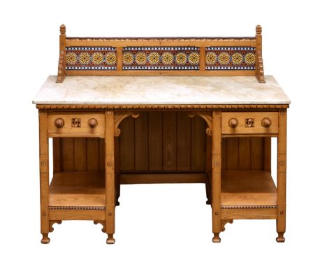A 19th century Aesthetic Movement inlaid honey oak wash stand the three panel tiled gallery with carved finials over a marble