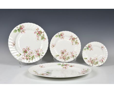 A Wedgwood 'Apple Blossom' pattern part dinner service comprising two oval 15½in. platters; a 10¼in. oval serving dish; six 1