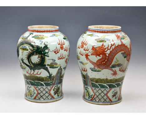 A pair of Chinese famille verte baluster dragon vases 20th century with earlier Kangxi marks, enamelled in bright polychrome 