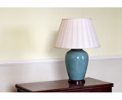 A Chinese porcelain duck egg blue crackle glazed vase lamp late 20th century, ovoid form, with turned wooden base and pleated