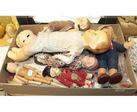 Papier mache head doll with spring coil body holding a rolling pin, fully dressed, three painted wooden dolls, 19th century p