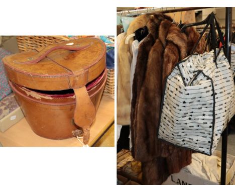 A leather hat case with a red silk quilted interior, a light mink short jacket, various other fur coats, stoles, hats, velvet