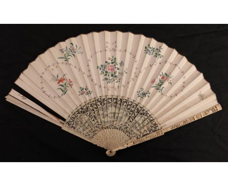 An 18th century ivory fan with carved Chinese Export monture, the double leaf delicately painted with flowers in pastels, wit