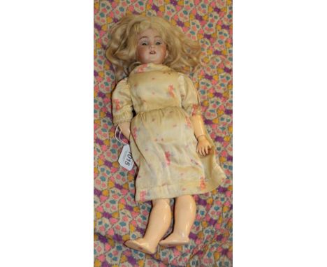 German S&amp;H 1249 small bisque socket head doll, with blond hair wearing a floral dress