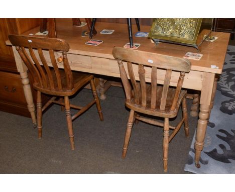 A Victorian pine kitchen table, fitted two drawers, 150cm long; together with two pine kitchen chairs (3)