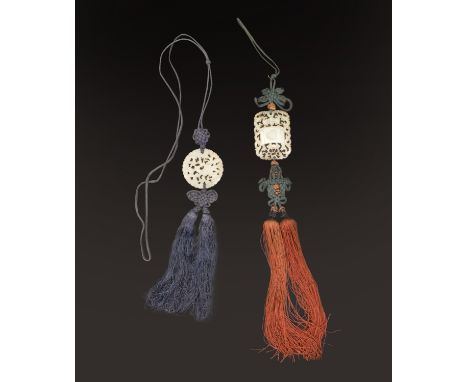 TWO CHINESE CELADON JADE PIERCED PENDANTS, QING DYNASTY, LATE 19TH/EARLY 20TH CENTURY清 青白玉掛件兩件 十九世紀至二十世紀初One carved with a st