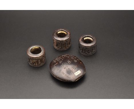 THREE CHINESE CARVED COCONUT ARCHERS THUMB RINGS, QING DYNASTY, 19TH CENTURY清 椰雕扳指一組 三件 十九世紀Each carved with stylised shou ch