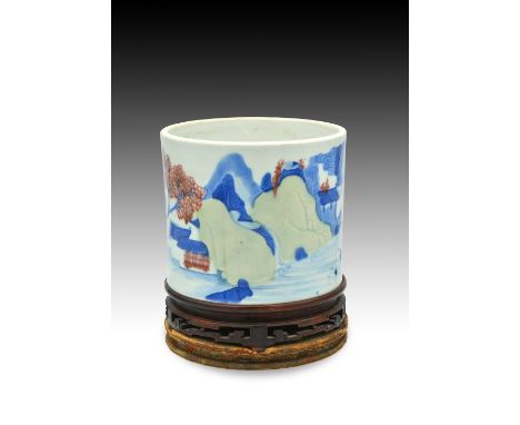 A CHINESE UNDERGLAZE-BLUE, COPPER-RED AND CELADON PORCELAIN ‘LANDSCAPE’ BRUSH POT, QING DYNASTY, KANGXI PERIOD, 1662 – 1722清 