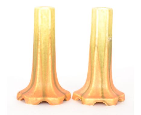 A matched pair of Ruskin Pottery crystalline lamp bases, each of hexagonal form and decorated with a streaked yellow and oran