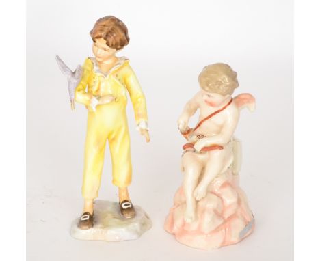 A Royal Worcester Freda Doughty figurine The Parakeet 3087 together with a KPM model of a seated Cupid, printed marks to both