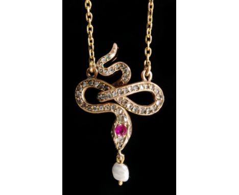 An early 20th Century 15ct diamond, ruby and pearl snake pendant, the coiled serpents body millegrain set with old cut diamon