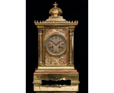 A late 19th Century brass and copper eight day strike mantle clock the case detailed with figures in an Arabian landscape abo