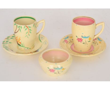A Clarice Cliff Lynton shape coffee can and saucer circa 1937 in the Dry Day pattern, hand painted with a stylised tree and f