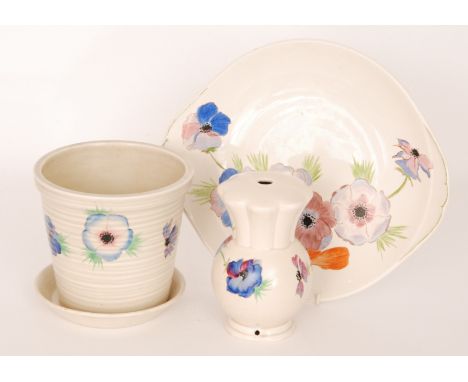 A late 1930s Clarice Cliff lamp base of footed spherical form with a fluted collar neck, hand painted in the Anemone pattern 