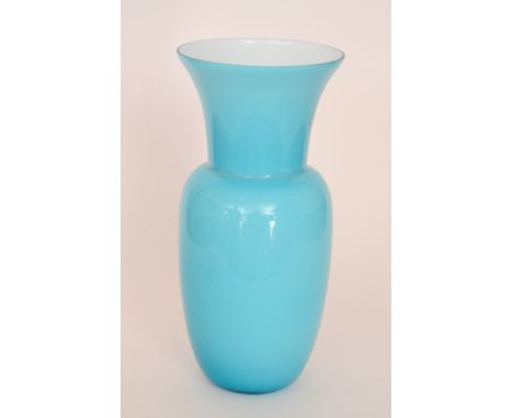 A large contemporary Italian Murano glass vase by C. Nason of ovoid form with an everted rim, cased in pale blue crystal over