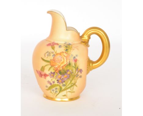 An early 20th Century Royal Worcester flatback jug, shape 1094, the body decorated with a spray of flowers against a blush gr