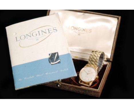A 1950s 9ct Longines gentleman's automatic wristwatch, the champagne circular dial with Arabic and dart markers, baton hands 
