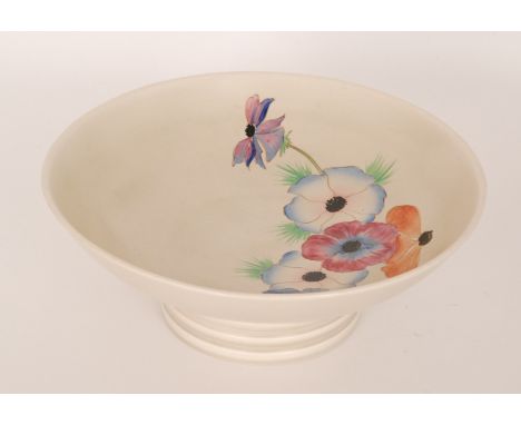 A large late 1930s Clarice Cliff bowl of shallow circular form raised to a collar foot, hand painted in the Anemone pattern w