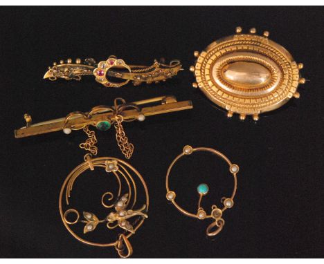 Three early 20th Century brooches to include a ruby and diamond set crescent mounted bar brooch, a 9ct oval mourning brooch w