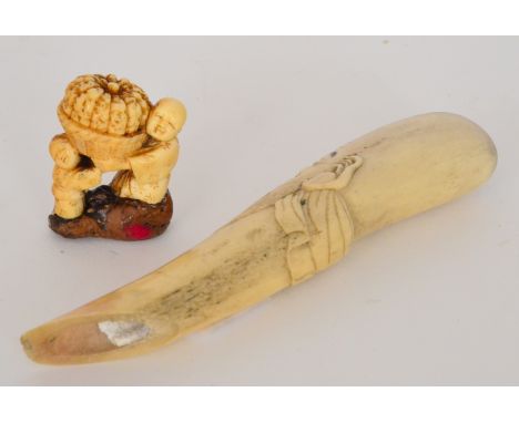 A Meiji period Japanese carved bone walking cane handle, carved and stained in the form of a bearded man, together with a sim