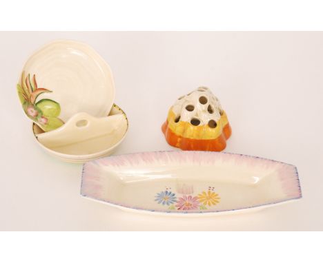 A small collection of Clarice Cliff to comprise a banded flower frog, twin bon bon dish, small water lily dish and a rounded 