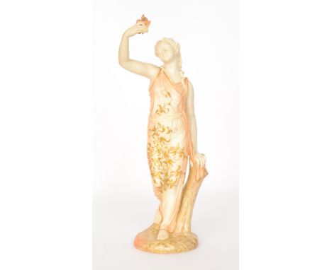 A large Royal Worcester figurine 'Captivity' modelled as a maiden dressed in robes holding aloft a dove in her hand, decorate