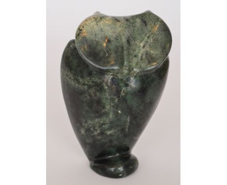 A large 20th Century New Zealand jade or pounamu carved owl sculpture with flattened back and domed stylised foot, height 18c