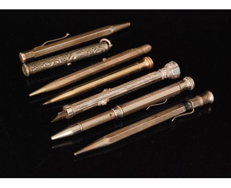 Seven assorted silver and white metal pens and pencils to include an S Mordan & Co slide case and engine turned decorated exa