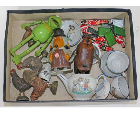 A mixed lot comprising A German tinplate clockwork penguin, a Marx plastic clockwork womble, William Grant & Sons diecast gua