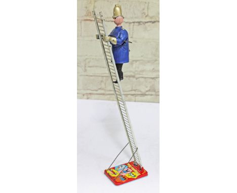 A Marx tinplate Trumpton Town Fire Brigade mechanical man on ladder. CONDITION REPORT - good, general wear, appears in workin