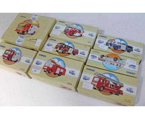 A group of eight boxed model Corgi fire engines.